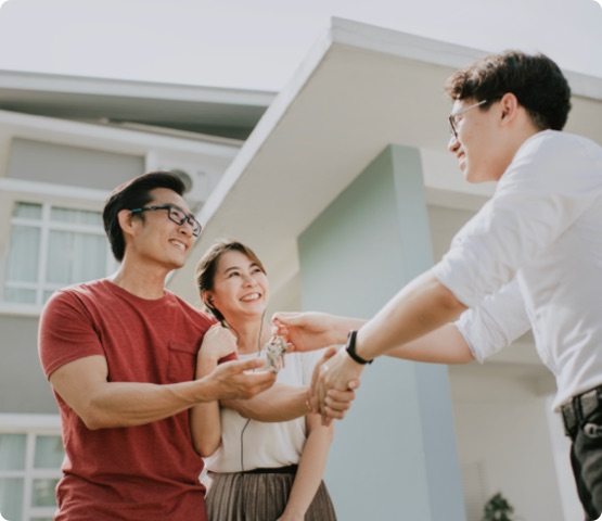 an asian chinese family moving into new house and received the house key from real estate agent